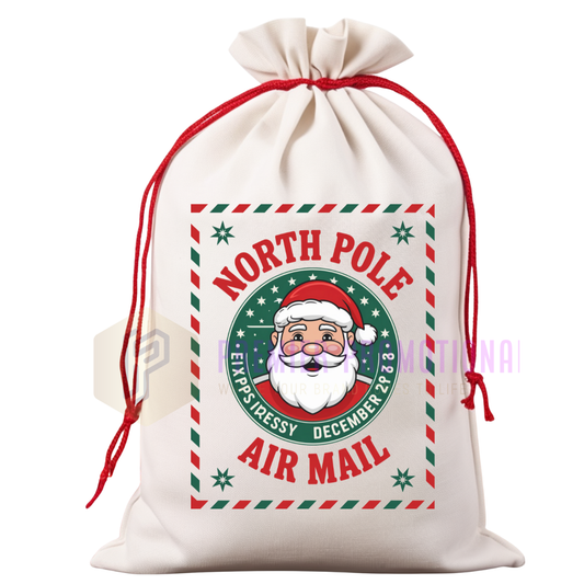 White drawstring bag with Santa Claus design and 'North Pole Air Mail' text on a white background